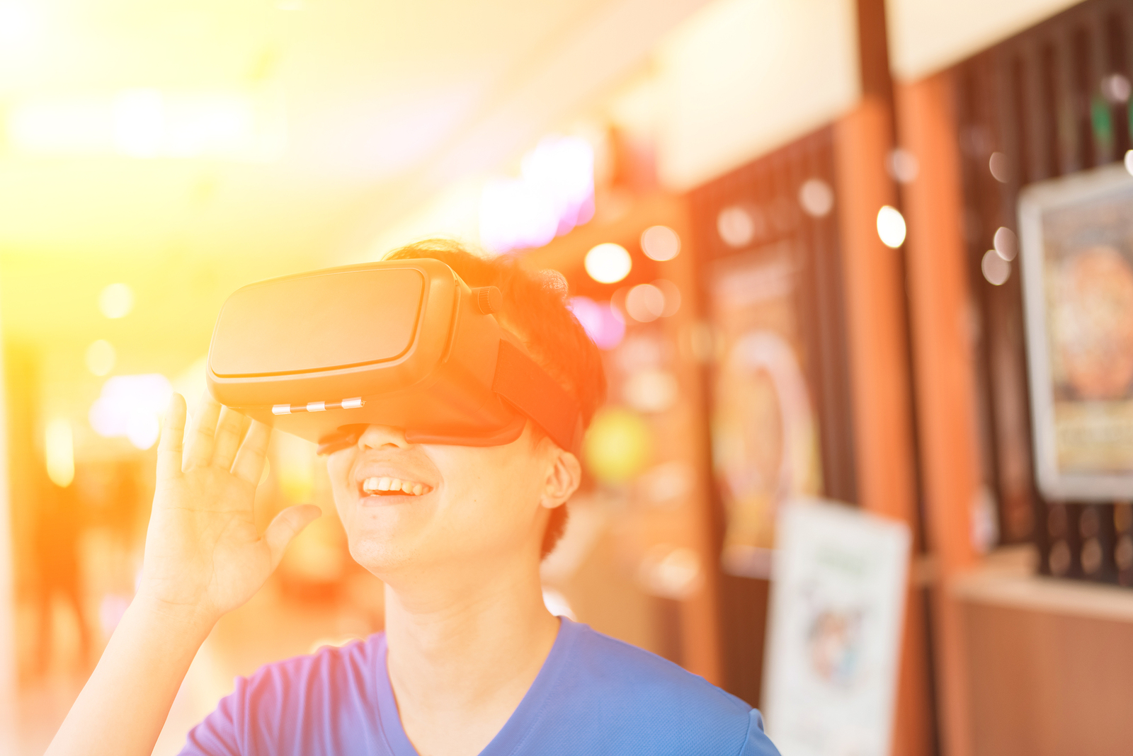 Smile happy man getting experience using VR-headset glasses of v